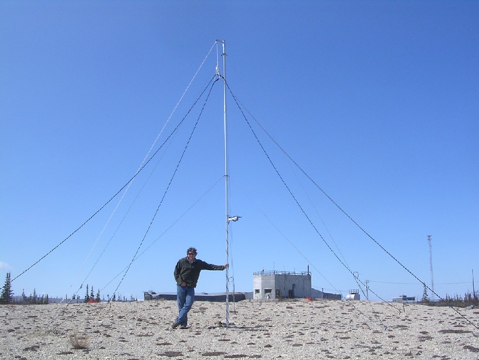 Mark Clilverd standing beneath the AARDDVARK VLF Antenna