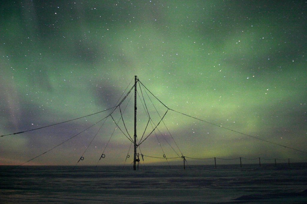 Loop antenna at the British Antarctic Survey base, Halley, Antarctica with the aurora as a backdrop. Photo courtesy of Jeff A. Cohen.